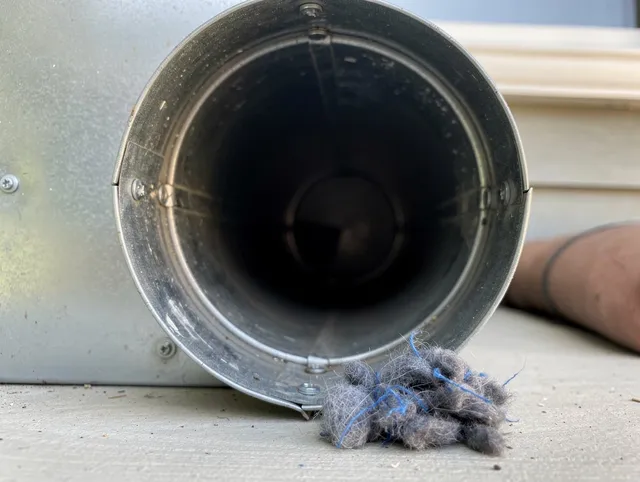 Mead Valley Dryer Vent Cleaning technician using specialized equipment to clear severe dryer vent blockage in Mead Valley